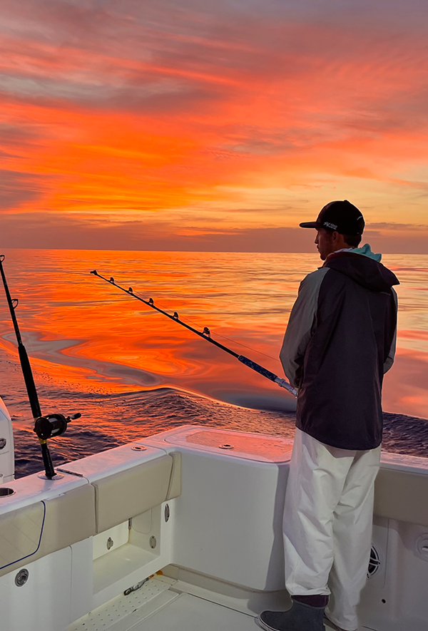 Fishing Charter Captain Christian Patrick fishing at sunset on the SeaVee 370z