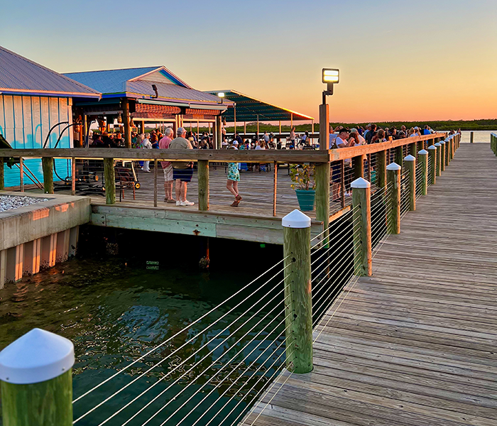 Image of the back deck of the building for Off the Hook Restaurant and bar at Inlet Harbor