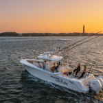 image of the Change 'N Latitude SeaVee 370z at sunset on the water of the Ponce Inlet